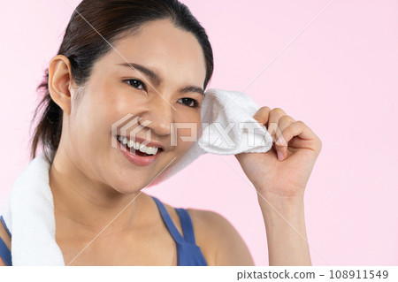 Athletic and sporty asian woman resting after intensive cardio. Vigorous Athletic and sporty asian woman resting after intensive cardio. Vigorous 108911549