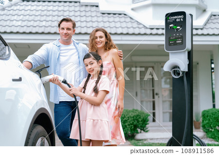 Electric vehicle and modern family at home concept. Synchronos Electric vehicle and modern family at home concept. Synchronos 108911586