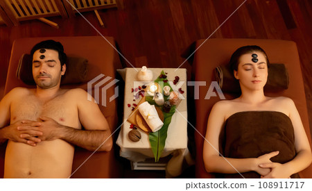 Caucasian couple enjoying relaxing anti-stress head massage with stone.Quiescent 108911717