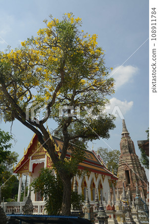 The main chedi is located behind the chapel of Wat Mai Prachamphon. It looks like a pagoda with a large corner added. The base is square, 15 meters long on each side, and 24 meters high. Thailand. 108911784