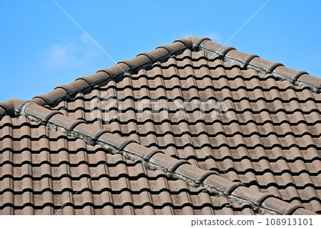 grey roof tile of house on blue sky and white cloud background 108913101