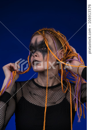 Cinematic portrait of woman with horror stage make-up and without dangerous dreadlocks hairstyle Cinematic portrait of woman with horror stage make-up and without dangerous dreadlocks hairstyle 108913576