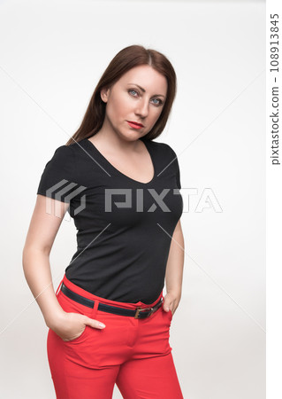 Portrait of 40-year-old brunette woman stares in camera. Female with long hair on white background Portrait of 40-year-old brunette woman stares in camera. Female with long hair on white background 108913845