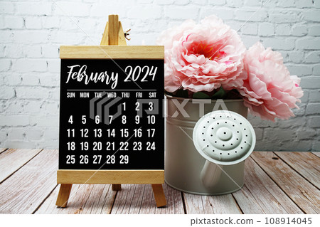February 2024 monthly calendar with flower bouquet decoration on wooden background February 2024 monthly calendar with flower bouquet decoration on wooden background 108914045