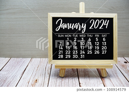 January 2024 monthly calendar on easel stand on wooden background 108914579
