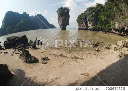 Tropical limestone island on a sunny day in Thailand. Tropical limestone island on a sunny day in Thailand. 108914620