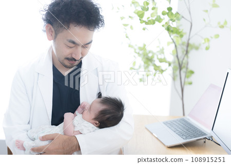 Doctor examining a baby Doctor examining a baby 108915251