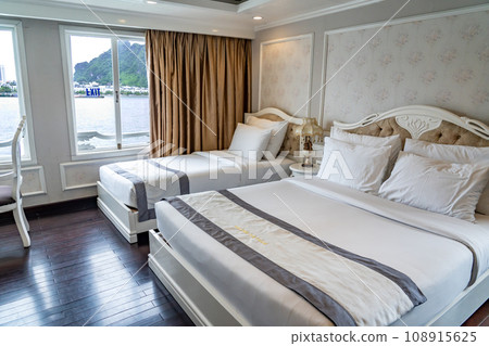Family room in a cruise ship cabin on a cruise in Halong Bay, Vietnam Family room in a cruise ship cabin on a cruise in Halong Bay, Vietnam 108915625