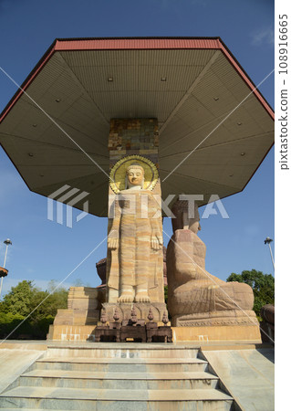 Phra Mahathat Jedi Phuttha Nimit and sand stone sitting buddha in Wat Phuttha Nimit or Wat Phu Khao. Which here is one of the important religions at Kalasin Province in Thailand. 108916665