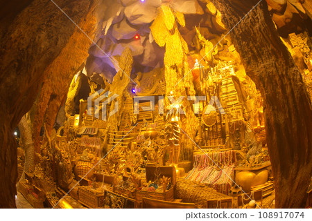 Replica treasures inside serpent cave tunnel For both Thai and foreign tourists to travel, pay homage to the Buddha image, ask for blessings, sacred things, pay homage at Maniwong Temple. Thailand. Replica treasures inside serpent cave tunnel For both Thai and foreign tourists to travel, pay homage to the Buddha image, ask for blessings, sacred things, pay homage at Maniwong Temple. Thailand. 108917074