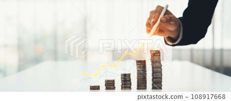 Coin stack with digital graphic indicator symbolize business investment. Shrewd Coin stack with digital graphic indicator symbolize business investment. Shrewd 108917668
