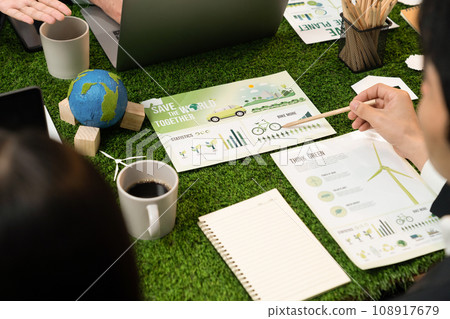 Diverse group of business people planning Eco business marketing. Quaint Diverse group of business people planning Eco business marketing. Quaint 108917679