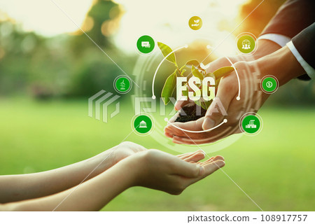 Businessman and little kid holding seedling plant together. Reliance Businessman and little kid holding seedling plant together. Reliance 108917757