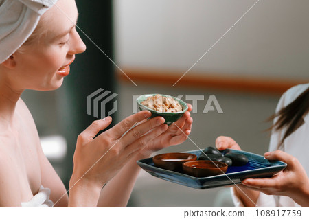 Portrait of two caucasian woman hold homemade facial mask. Close up. Tranquility Portrait of two caucasian woman hold homemade facial mask. Close up. Tranquility 108917759