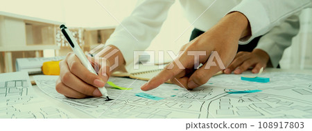 Worker, architect and engineer work on real estate construction project oratory Worker, architect and engineer work on real estate construction project oratory 108917803
