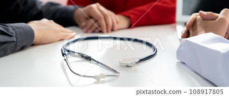 Couple attend fertility consultation with gynecologist at hospital. Rigid Couple attend fertility consultation with gynecologist at hospital. Rigid 108917805