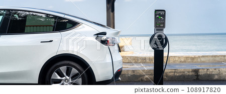 Electric car recharging battery at outdoor EV charging station. Perpetual Electric car recharging battery at outdoor EV charging station. Perpetual 108917820
