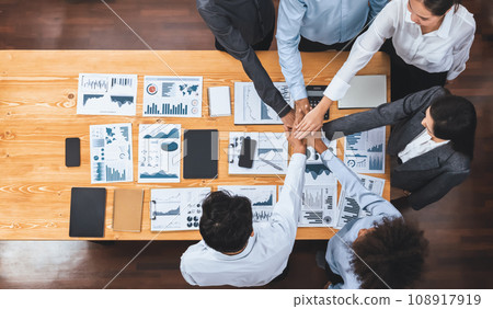 Top view office worker's hand stack shows solidarity in workplace. Concord 108917919