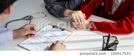 Couple attend fertility consultation with gynecologist at hospital. Rigid 108917935