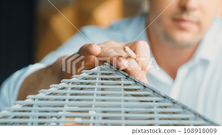 Professional architect engineer hands choose house roof material. Manipulator. 108918009