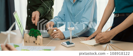 Windmill model and environmental document was placed at table. Delineation. Windmill model and environmental document was placed at table. Delineation. 108918122