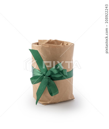 Front view of kraft gift box with green ribbon bow isolated on white Front view of kraft gift box with green ribbon bow isolated on white 108922243