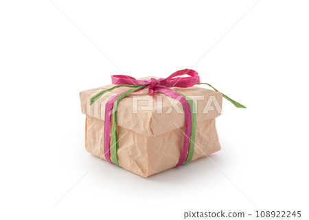 Front view of peach color gift box with purple-green paper ribbon bow isolated on white 108922245