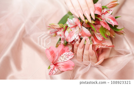 Elegant pastel pink natural manicure. Elegant pastel pink natural manicure. 108923321