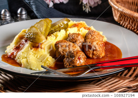 Meatballs pork and mashed potatoes topped with paprika gravy. Meatballs pork and mashed potatoes topped with paprika gravy. 108927194