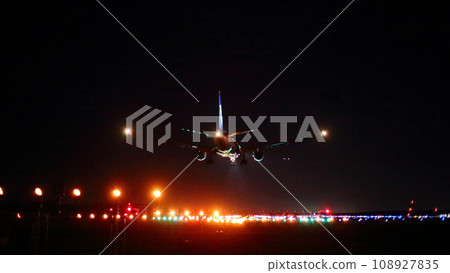 New Chitose Airport at night_B777 landing plane 108927835