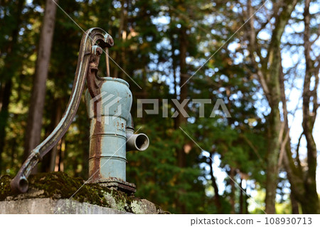 Old hand pump for a well 108930713