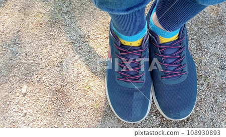 Adult feet playing in the park 108930893