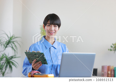 Female engineer inspecting the board 1 Female engineer inspecting the board 1 108931513