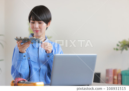 Female engineer inspecting the board 2 Female engineer inspecting the board 2 108931515