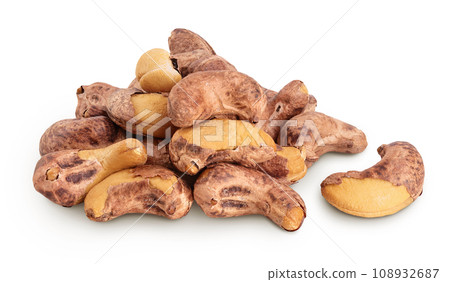 cashew nuts heap with shell isolated on white background 108932687