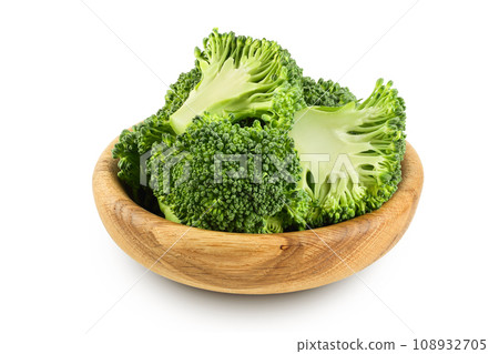 fresh broccoli in wooden bowl isolated on white background close-up with full depth of field. fresh broccoli in wooden bowl isolated on white background close-up with full depth of field. 108932705