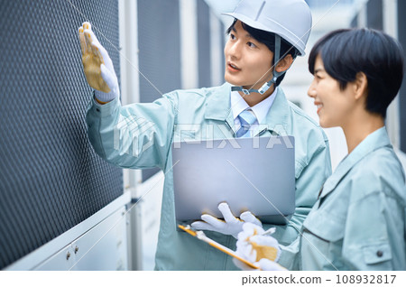 Male and female workers performing inspection work Photography cooperation: Ariake College of Education and Art Male and female workers performing inspection work Photography cooperation: Ariake College of Education and Art 108932817