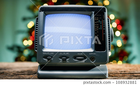 Old static tv with Christmas background  108932881