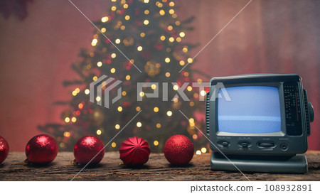 Static Television playing under Christmas tree, copy space 108932891