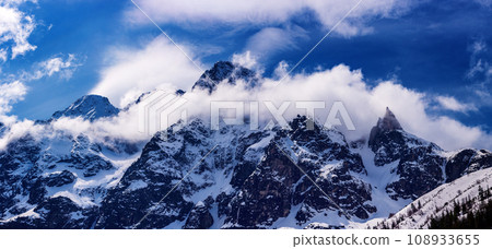 Mountain peaks near Morskie Oko or Sea Eye Lake in Poland at Winter. Tatras range Mountain peaks near Morskie Oko or Sea Eye Lake in Poland at Winter. Tatras range 108933655