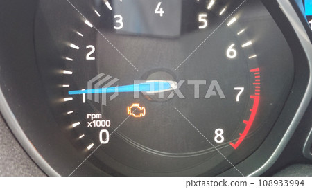 yellow engine icon on car instruments 108933994