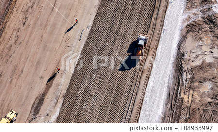 heavy construction equipment on a construction site heavy construction equipment on a construction site 108933997
