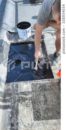 roof repair, professional bituminous waterproofing on a flat building roof repair, professional bituminous waterproofing on a flat building 108934034