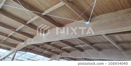 Wooden roof structure. Glued laminated timber roof. Rafters made of wood. 108934040
