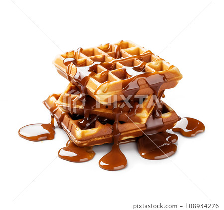 Waffle with caramel topping on white backgrounds Waffle with caramel topping on white backgrounds 108934276