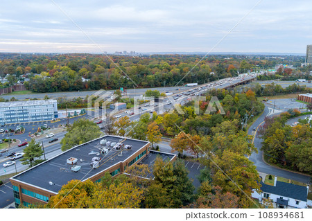This aerial view American freeway I-95 NJ Turnpike with heavy traffic moving quickly from left to right This aerial view American freeway I-95 NJ Turnpike with heavy traffic moving quickly from left to right 108934681