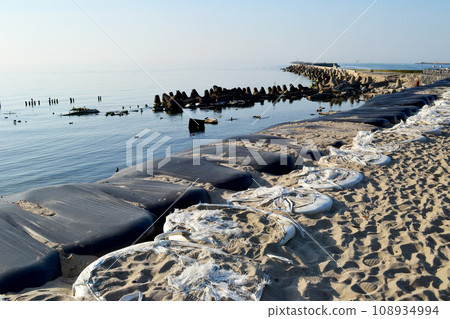 Baltiysk, Kaliningrad region, Southern pier on the Baltic spit, flood and destruction protection, shore reinforcement, embankment, concrete breakwaters 108934994