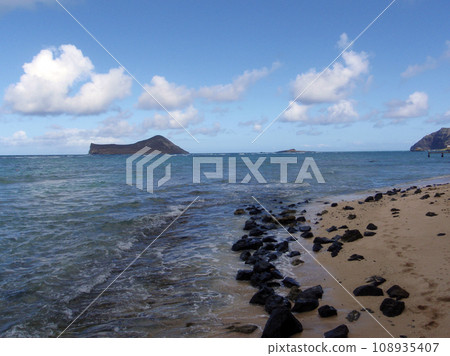 Waimanalo Beach with rocks along the beach on Oahu, Hawaii Waimanalo Beach with rocks along the beach on Oahu, Hawaii 108935407