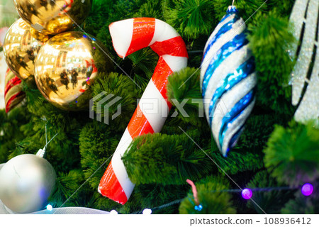 various Christmas decorations on the tree, decorations 108936412