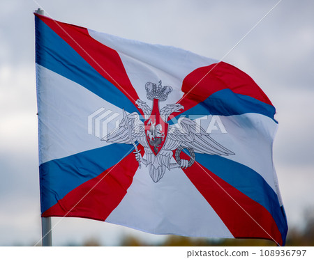 The flag of the Ministry of Defense of the Russian Federation is flying in the wind against a cloudy sky. The flag of the Ministry of Defense of the Russian Federation is flying in the wind against a cloudy sky. 108936797